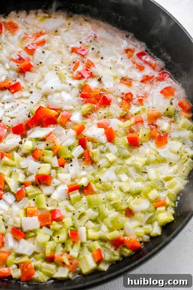 This Tuna Noodle Casserole is a creamy, cheesy, and comforting dish made from scratch, perfect for an easy and satisfying weeknight dinner. frying diced red peppers and diced celery in butter