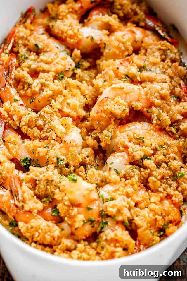 Shrimp Delectables: Garlic Butter Baked and De Jonghe 6 Baked shrimp in a white oval dish.