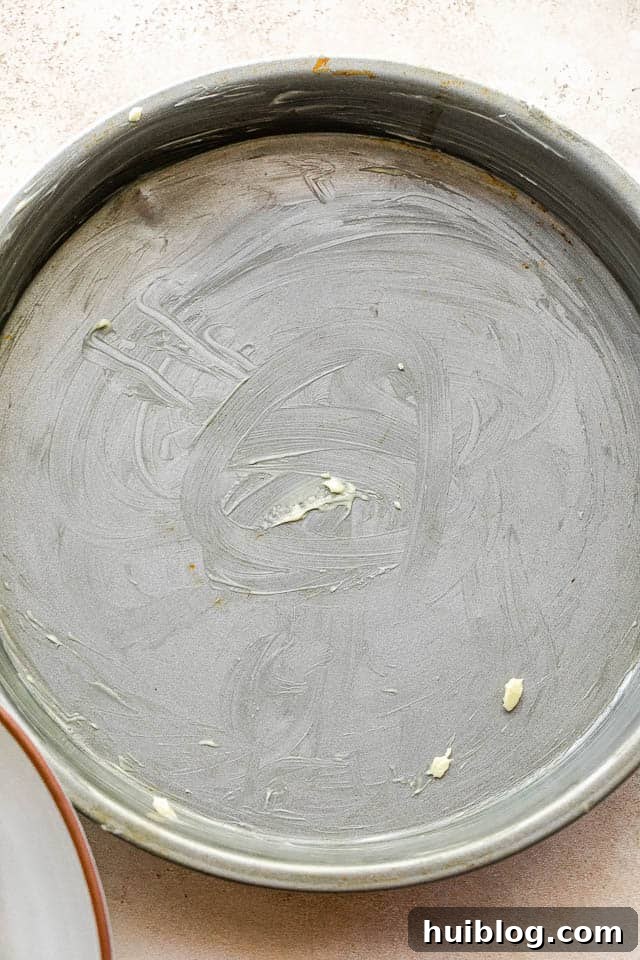 overhead shot of buttered cake pan