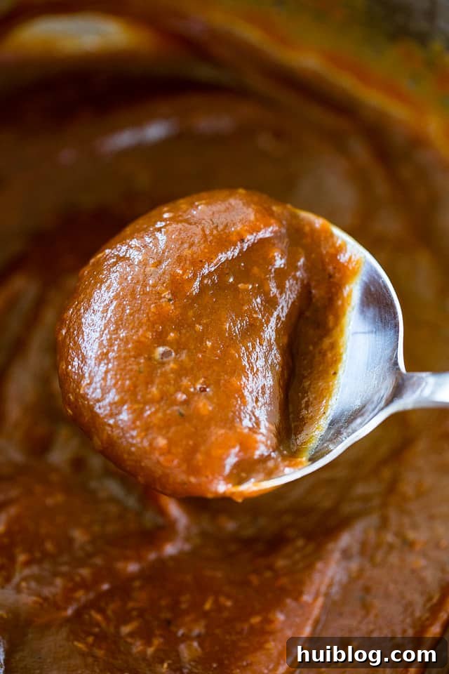 overhead shot of apple butter on a spoon