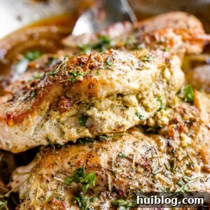 side shot of pesto filling stuffed in pork chops