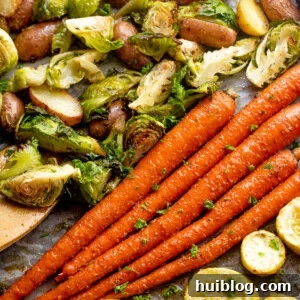 overhead shot of roasted vegetables on a baking sheet