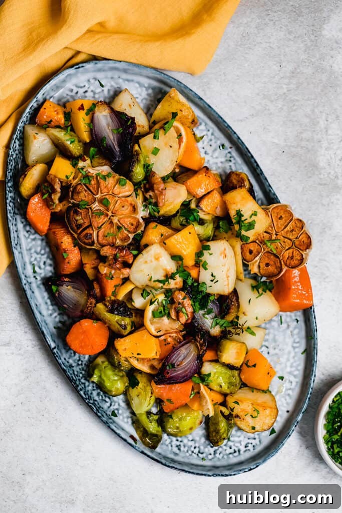 Roasted vegetables on a blue serving platter.