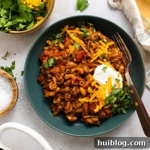 Three bowls of chili Mac on a table