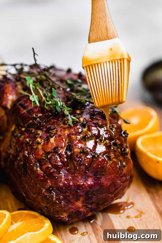 Brown Sugar Glaze Being Poured Over a Fresh-From-the-Oven Ham, creating a stunning visual and aromatic experience.