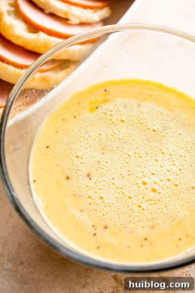 eggs and milk mixture in a large glass bowl