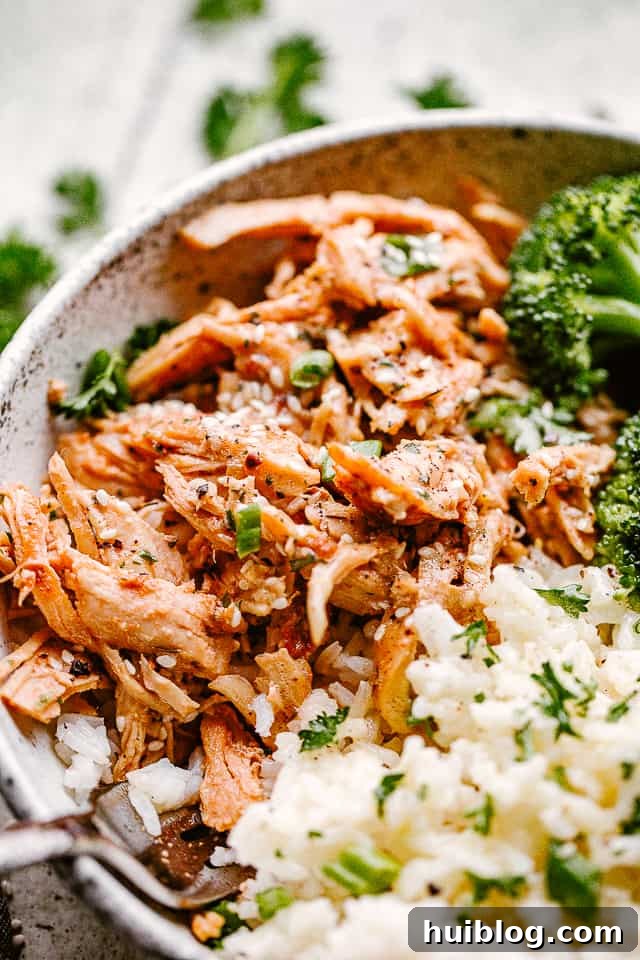 Close up of honey garlic chicken and rice in a bowl.