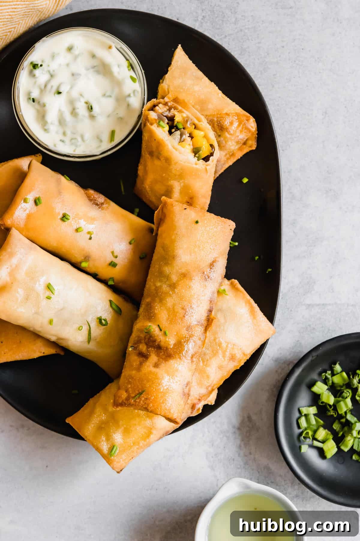 Cheesecake Factory Inspired Tex-Mex Egg Rolls 3 A Platter of Crispy Homemade Egg Rolls on a Gray Countertop Ready to Be Served