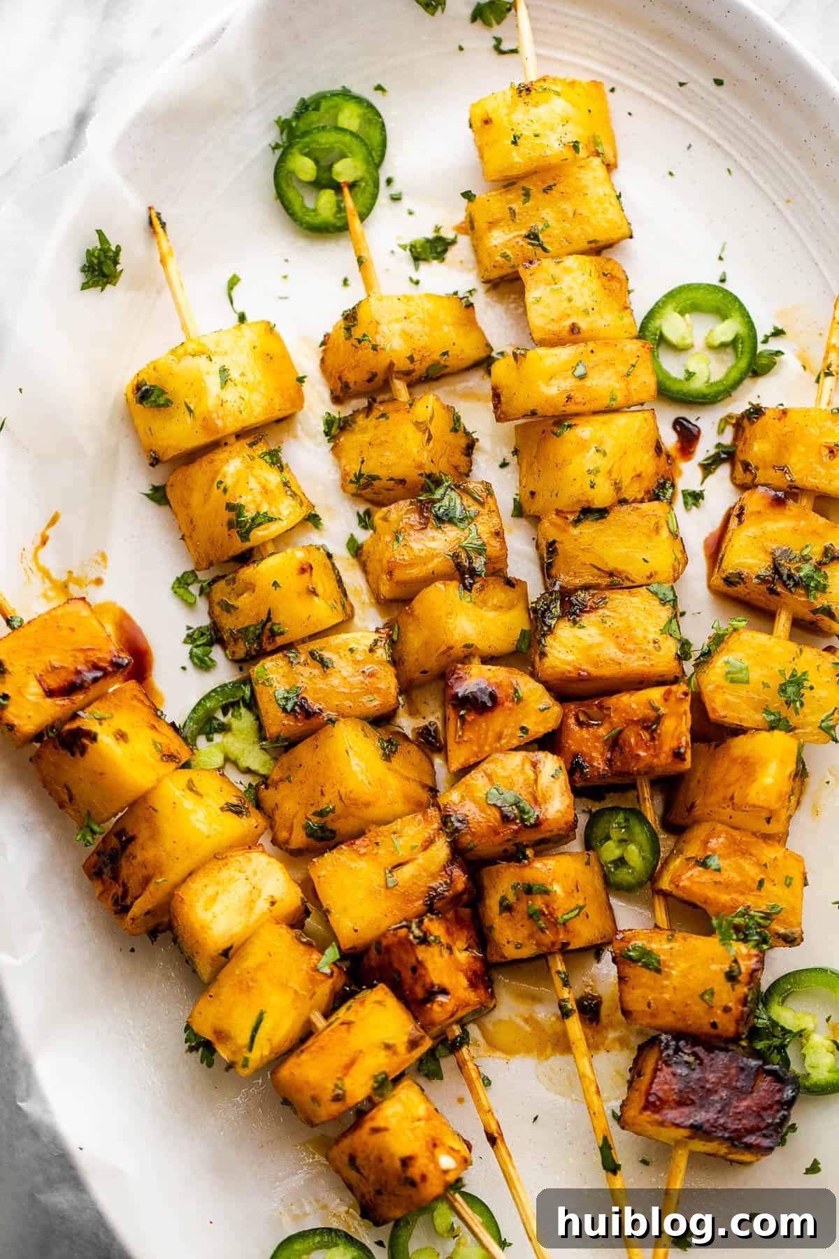 five skewers with pineapples
