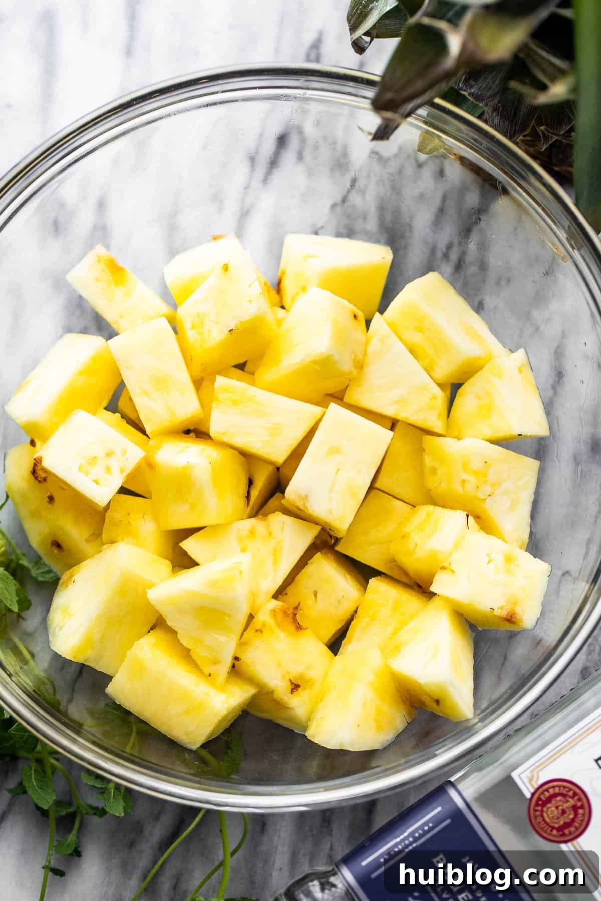 diced fresh pineapple in a glass bowl