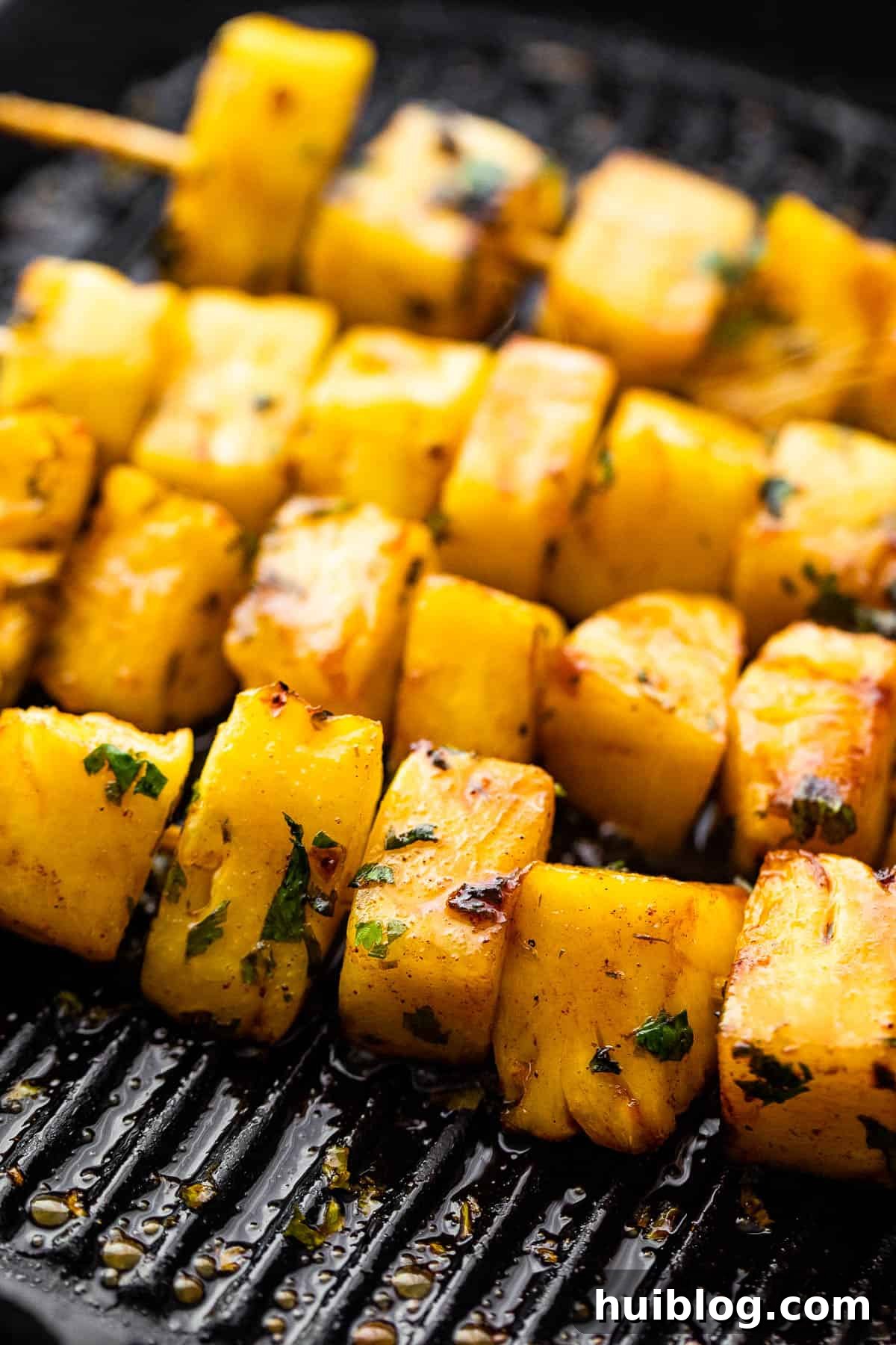 grilling pineapples on skewers