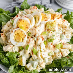 All-American Potato Salad 10 A Big Plate of Salad with Smaller Plates Stacked in the Background