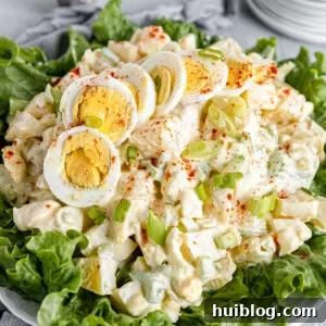 A Big Plate of Salad with Smaller Plates Stacked in the Background