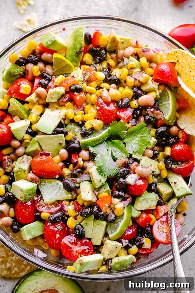 up close overhead shot of cowboy caviar, showcasing fresh vegetables and beans