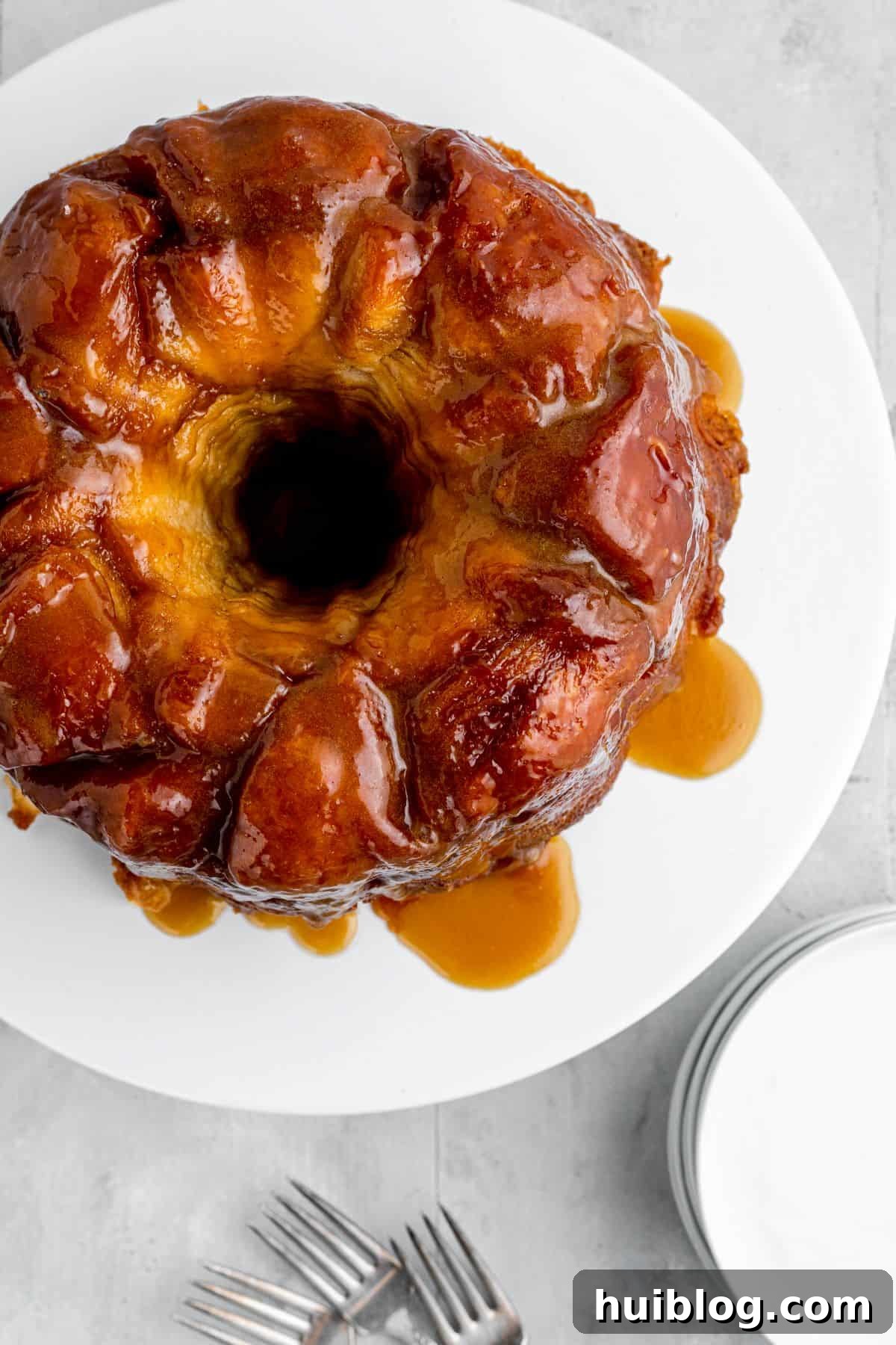 Gooey Cinnamon Pull-Apart Treat 3 A top-down shot of a golden-brown, ring-shaped monkey bread, fresh from the oven, showcasing its inviting pull-apart texture.