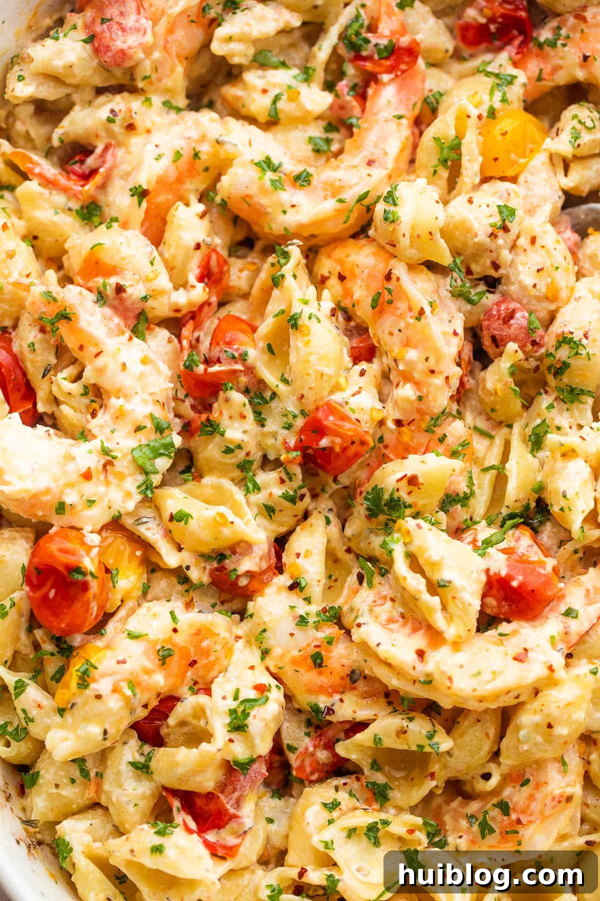 shrimp and pasta tossed with a cream cheese sauce and cherry tomatoes