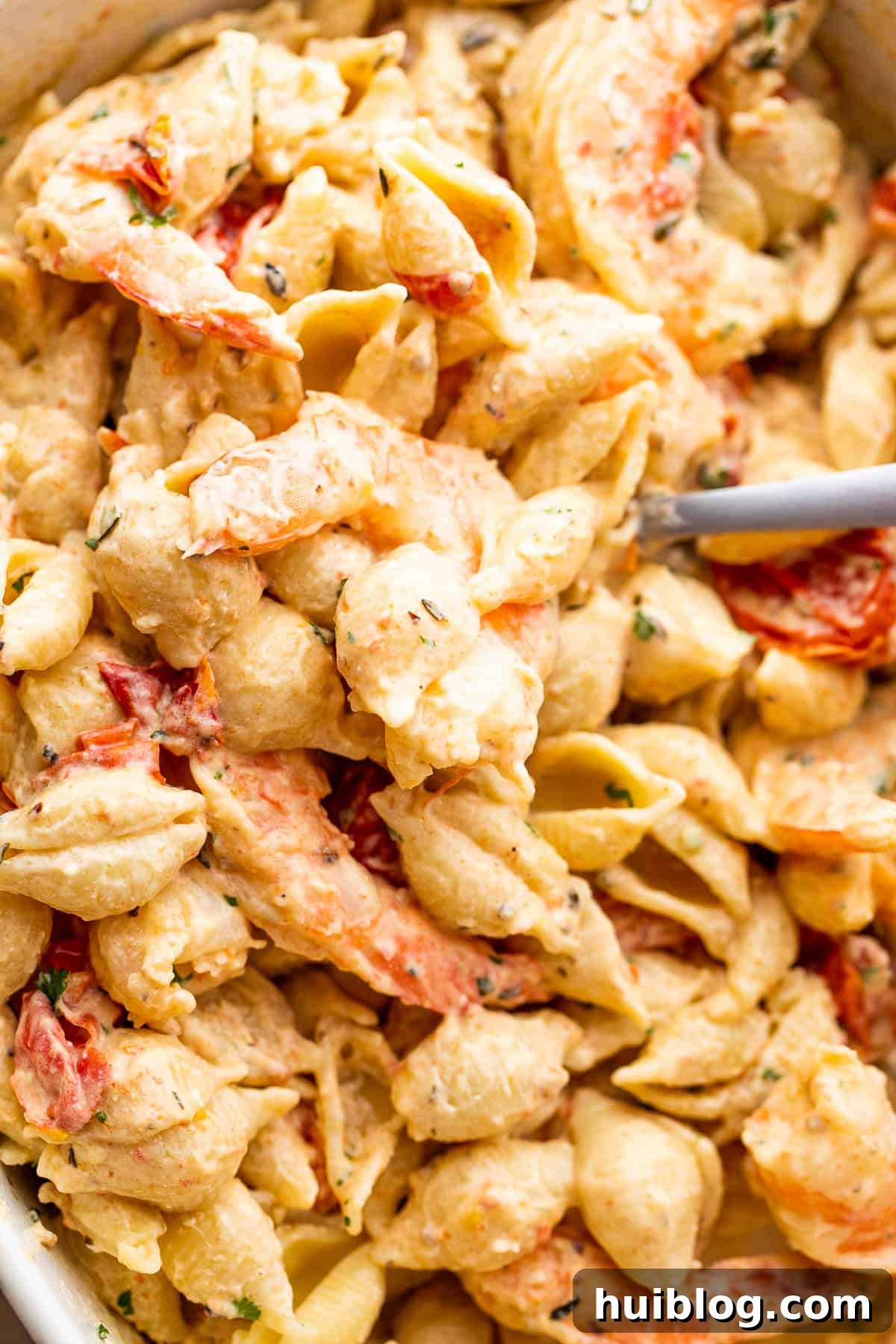 shrimp and pasta tossed with a cream cheese sauce and cherry tomatoes