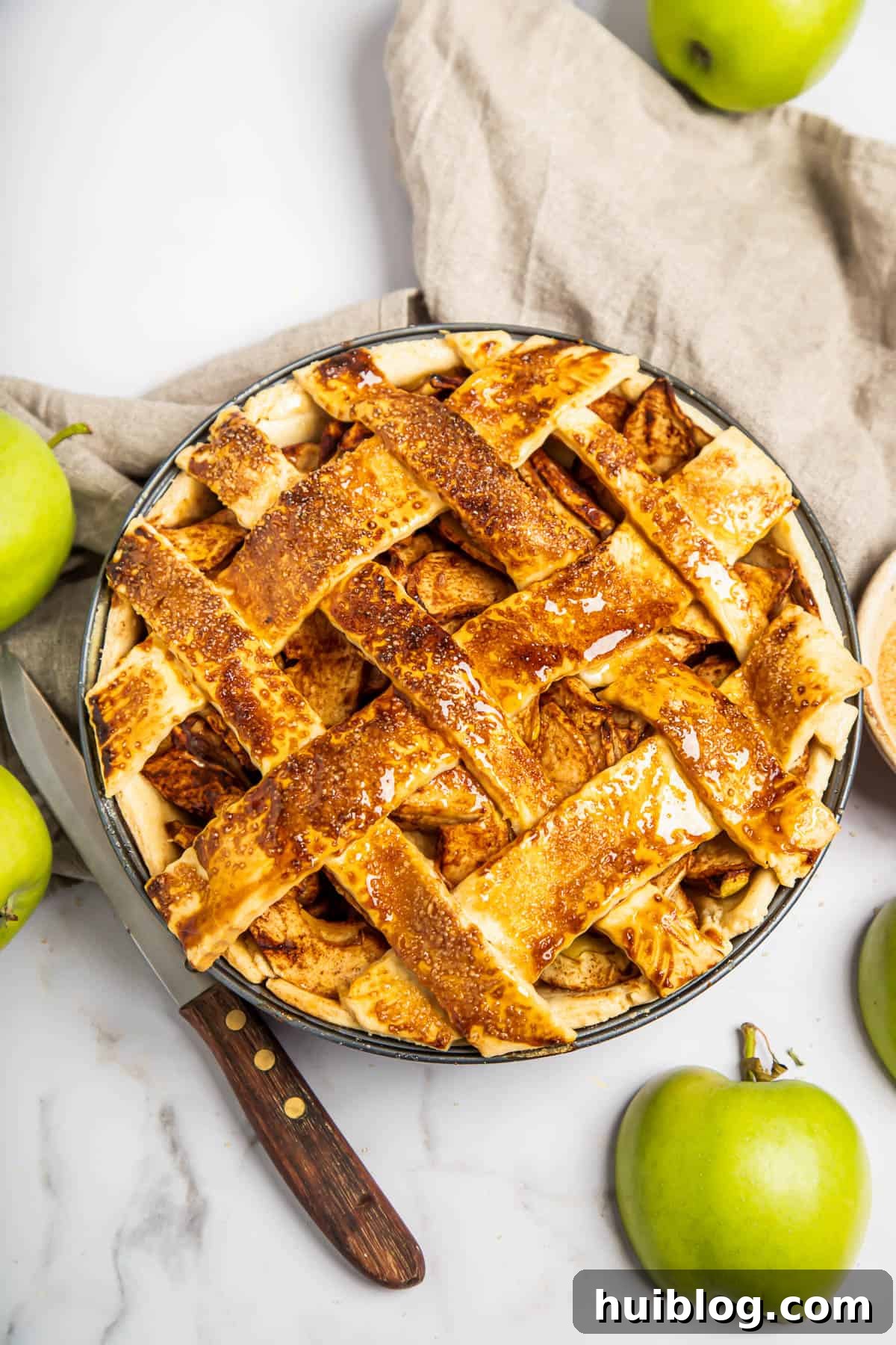A homemade apple pie with a lattice top.