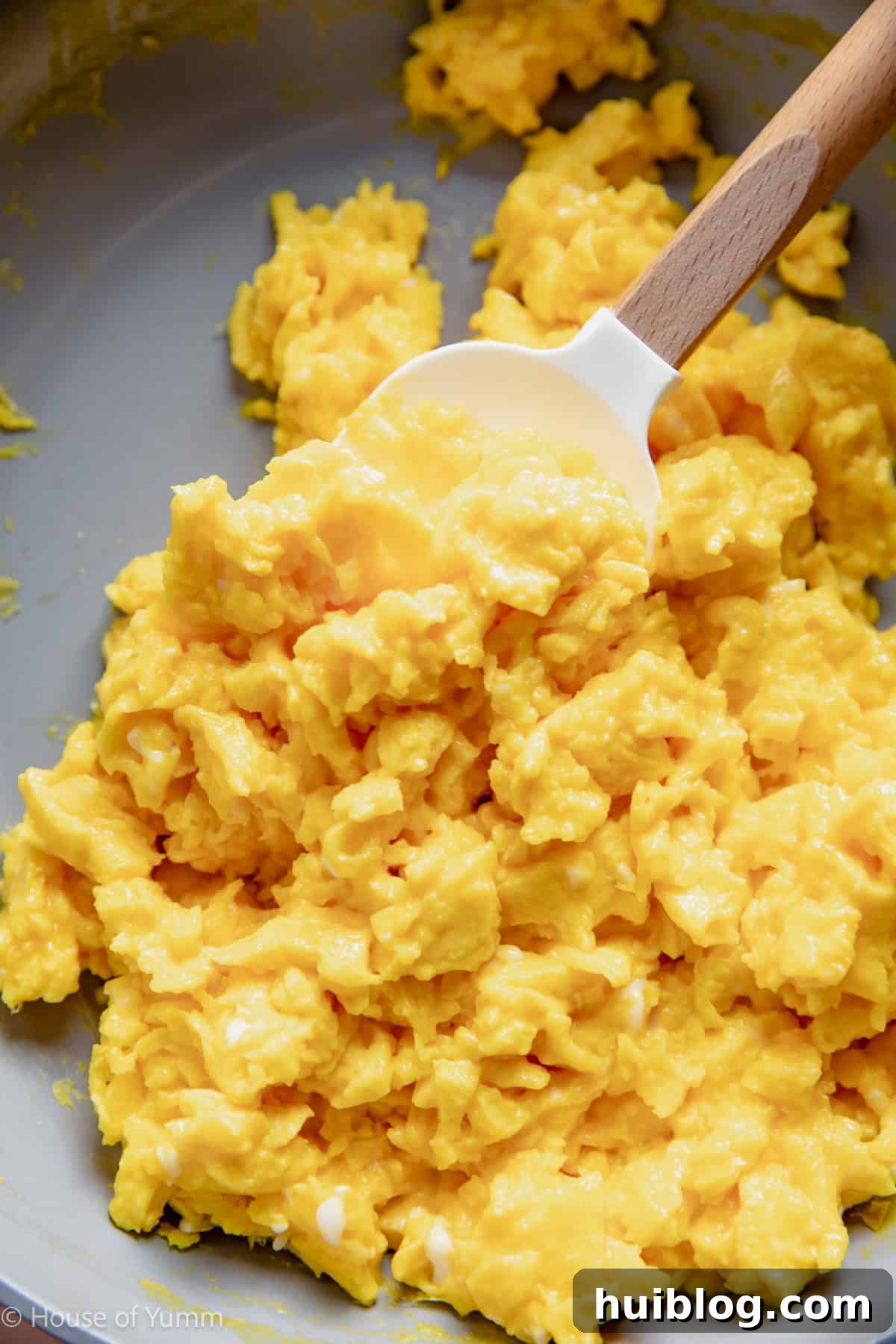 Scrambled eggs in a skillet.