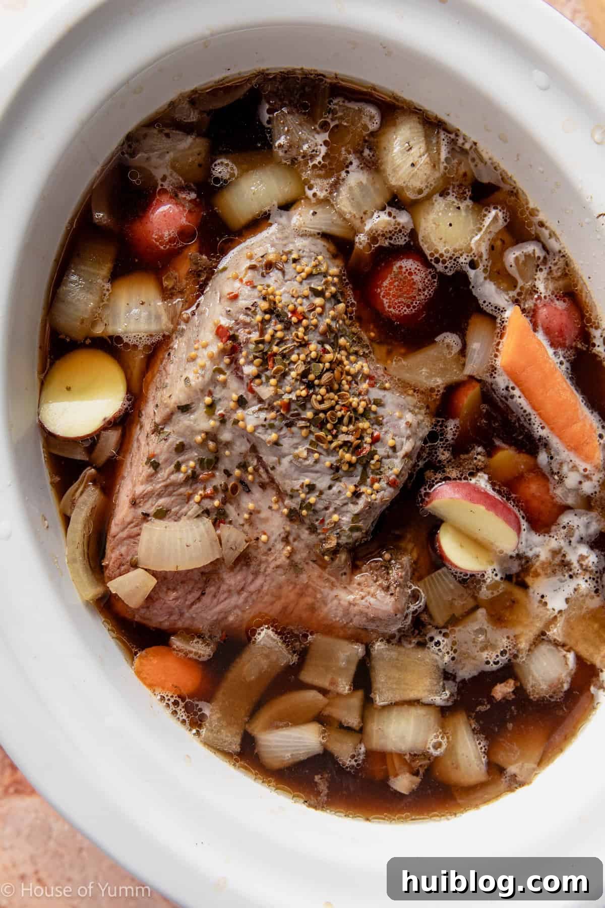 Corned beef cooked in slow cooker partway and adding potato and carrots. 