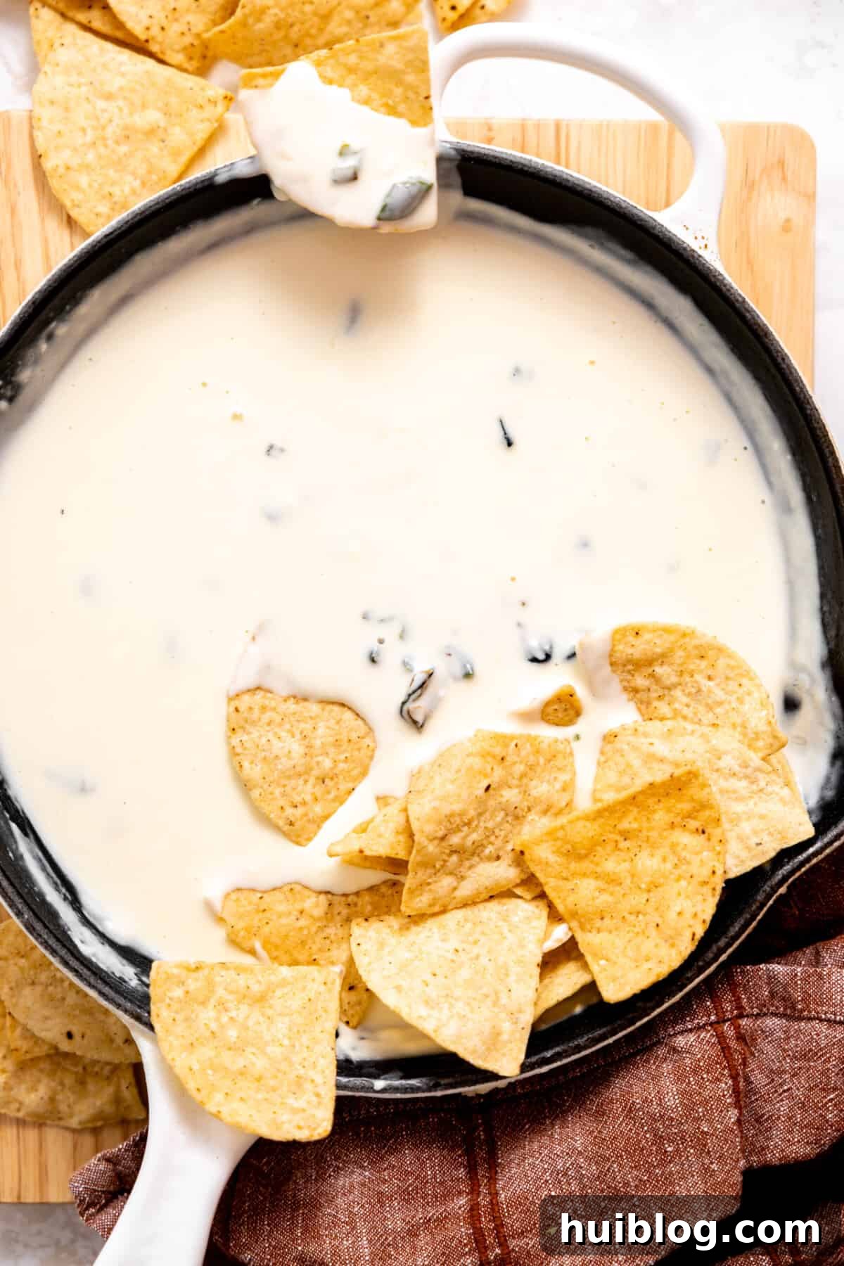 Skilled with white queso served with tortilla chips.